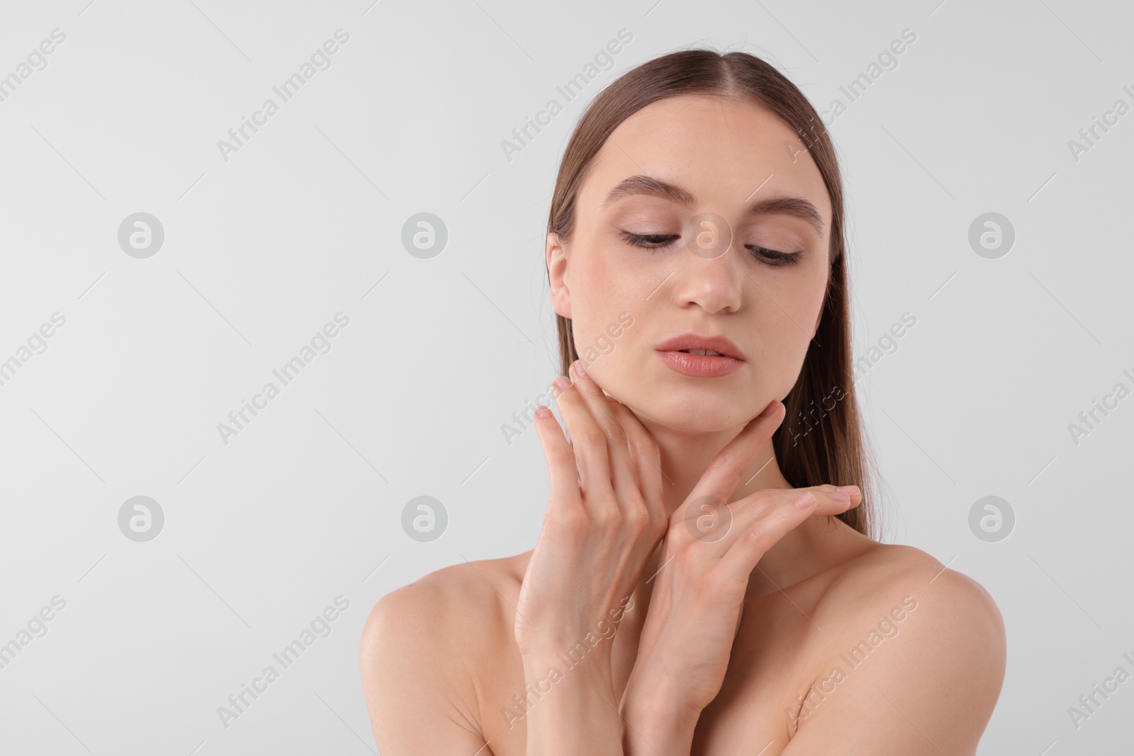 Portrait of attractive young woman on white background. Space for text Photo of Portrait of attractive young woman on white background. Space for text