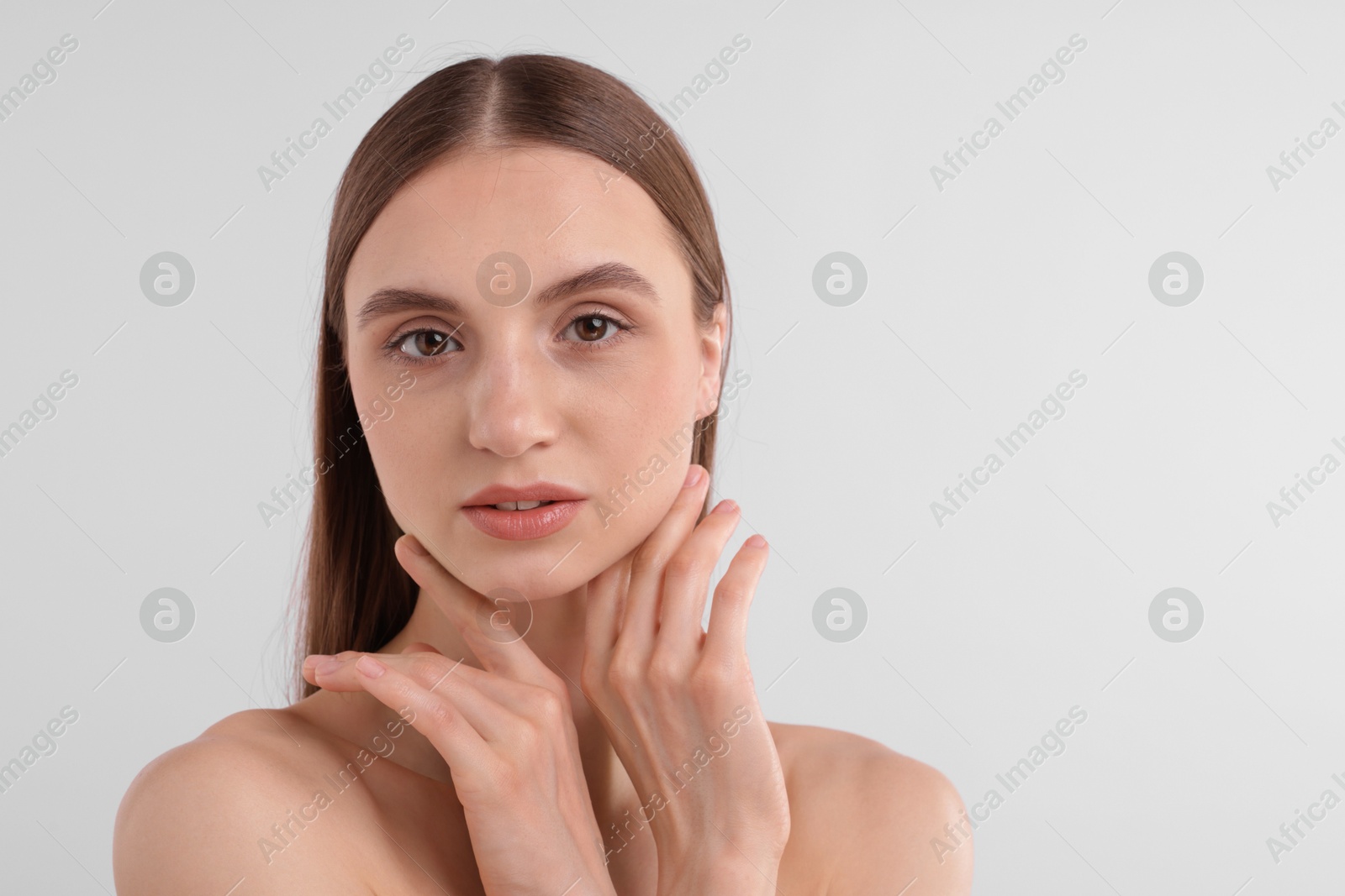 Portrait of attractive young woman on white background. Space for text Photo of Portrait of attractive young woman on white background. Space for text