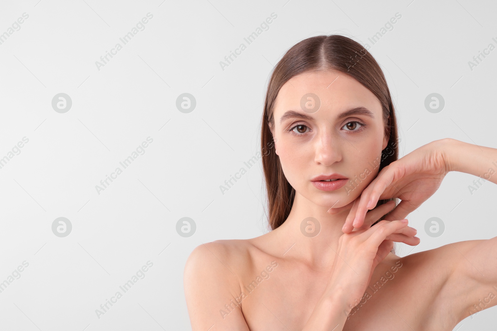 Portrait of attractive young woman on white background. Space for text Photo of Portrait of attractive young woman on white background. Space for text