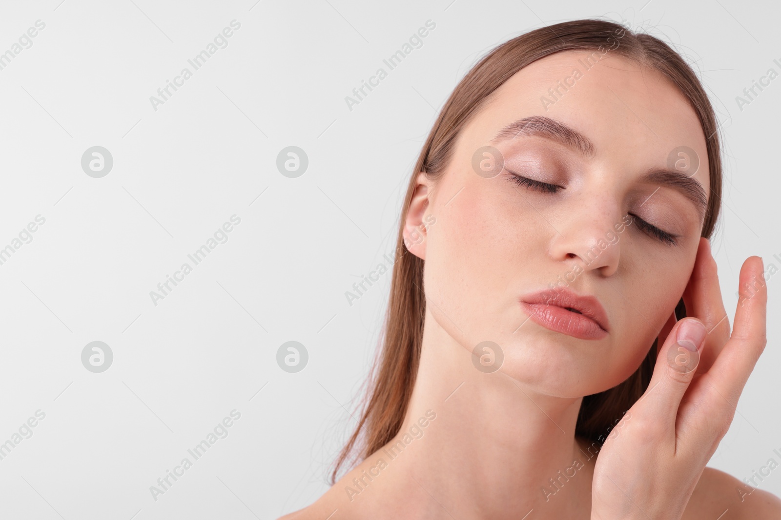 Portrait of attractive young woman on white background. Space for text Photo of Portrait of attractive young woman on white background. Space for text