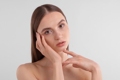Photo of Portrait of attractive young woman on white background