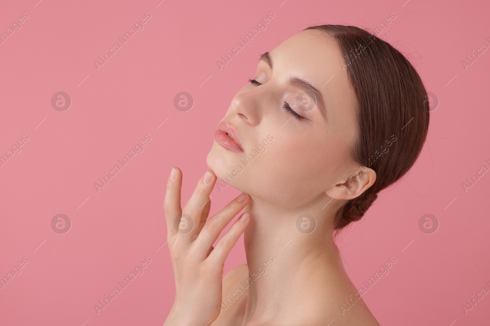 Portrait of beautiful young woman on pink background. Space for text Photo of Portrait of beautiful young woman on pink background. Space for text