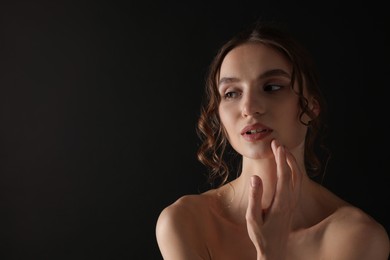Photo of Portrait of gorgeous young woman on black background. Space for text