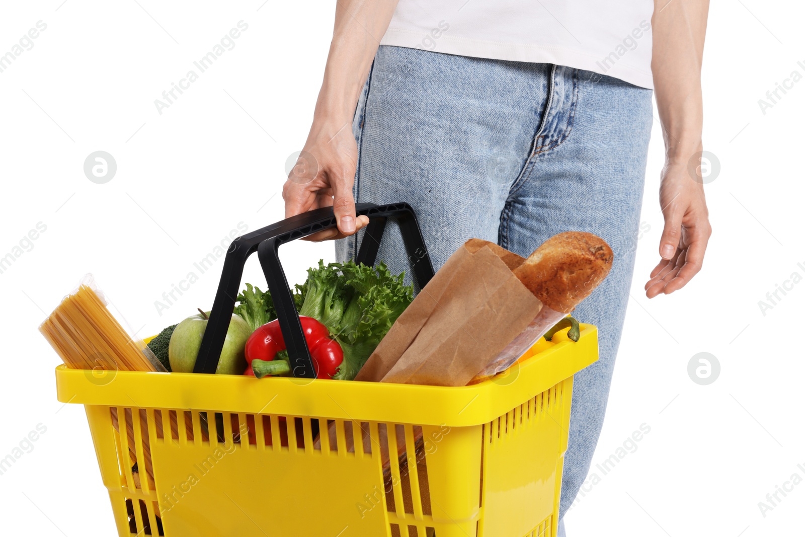 Photo of Woman with shopping basket full of products on white background, closeup