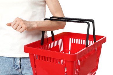 Photo of Woman with plastic shopping basket on white background, closeup