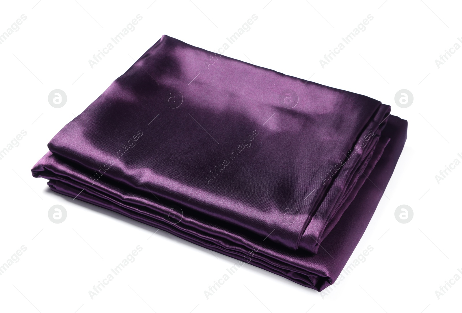 Silky purple bed linens on white background Photo of Silky purple bed linens on white background