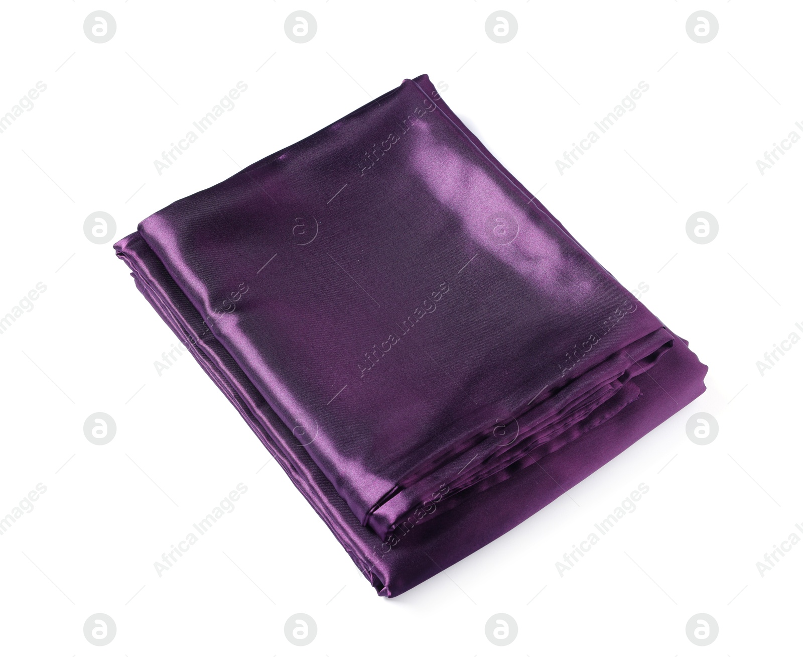 Silky purple bed linens on white background Photo of Silky purple bed linens on white background