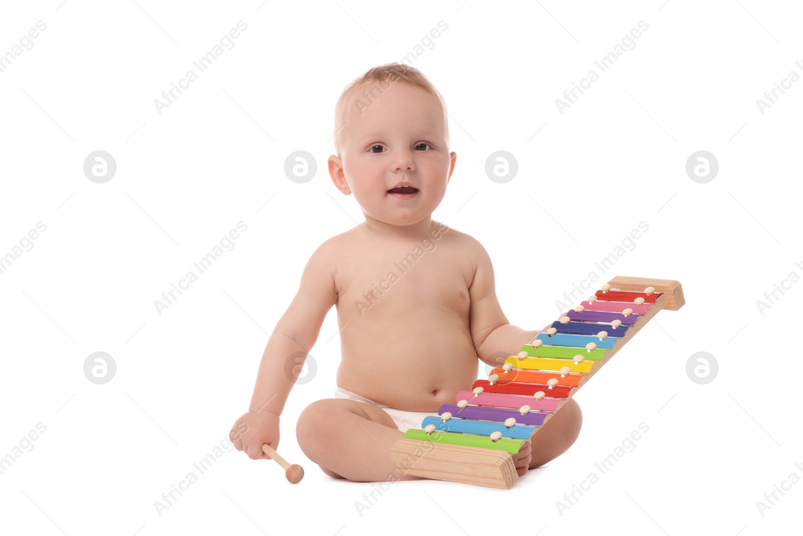Cute little baby playing with xylophone on white background Photo of Cute little baby playing with xylophone on white background