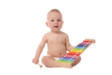 Photo of Cute little baby playing with xylophone on white background