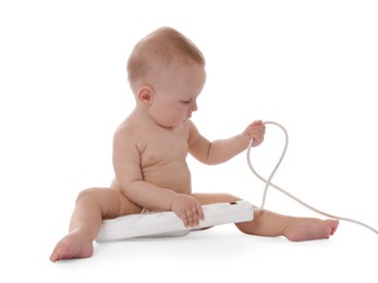 Photo of Cute little baby with extension cord on white background