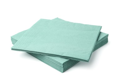 Photo of Many green paper handkerchiefs isolated on white