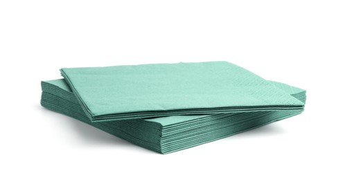 Photo of Many green paper handkerchiefs isolated on white