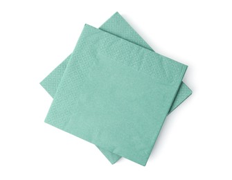 Photo of Many green paper handkerchiefs isolated on white, top view
