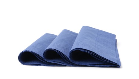 Photo of Many blue paper handkerchiefs isolated on white