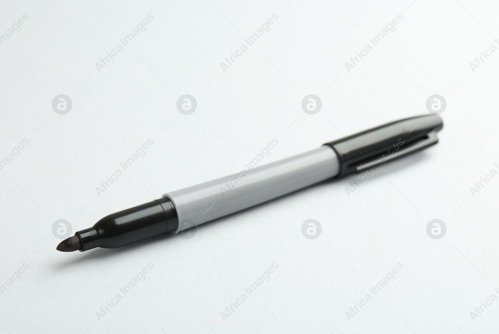 One black marker on light background. Space for text Photo of One black marker on light background. Space for text
