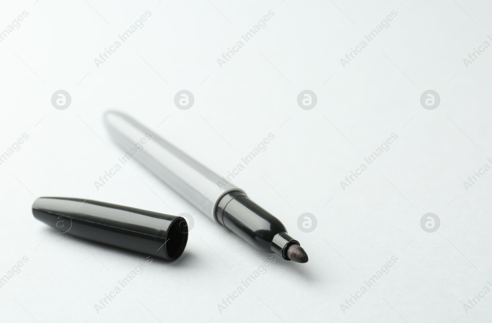 One black marker on light background. Space for text Photo of One black marker on light background. Space for text