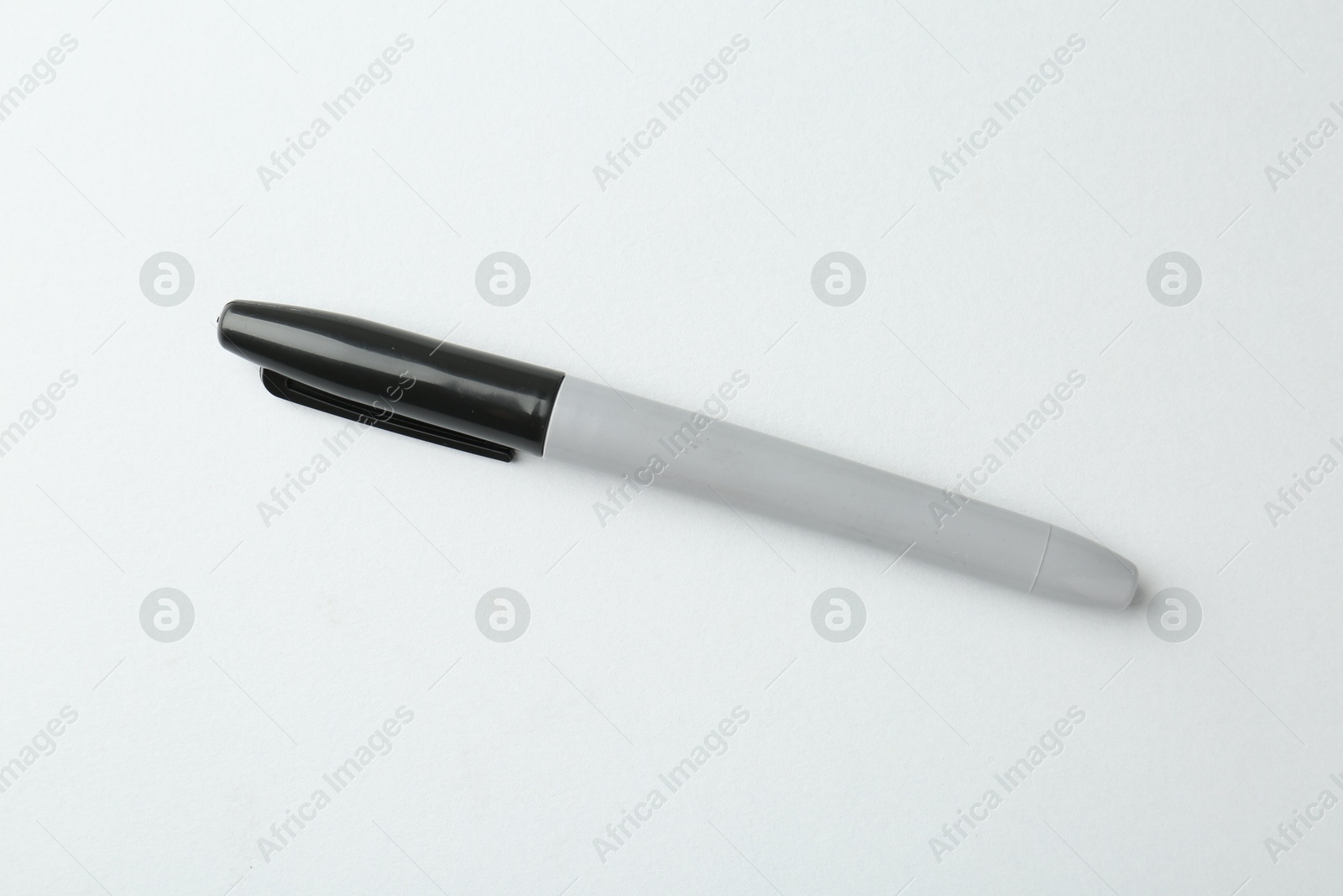 One black marker on light background, top view Photo of One black marker on light background, top view