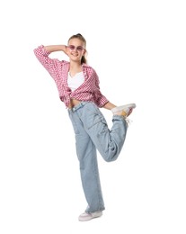 Photo of Girl in stylish clothes and sunglasses dancing on white background