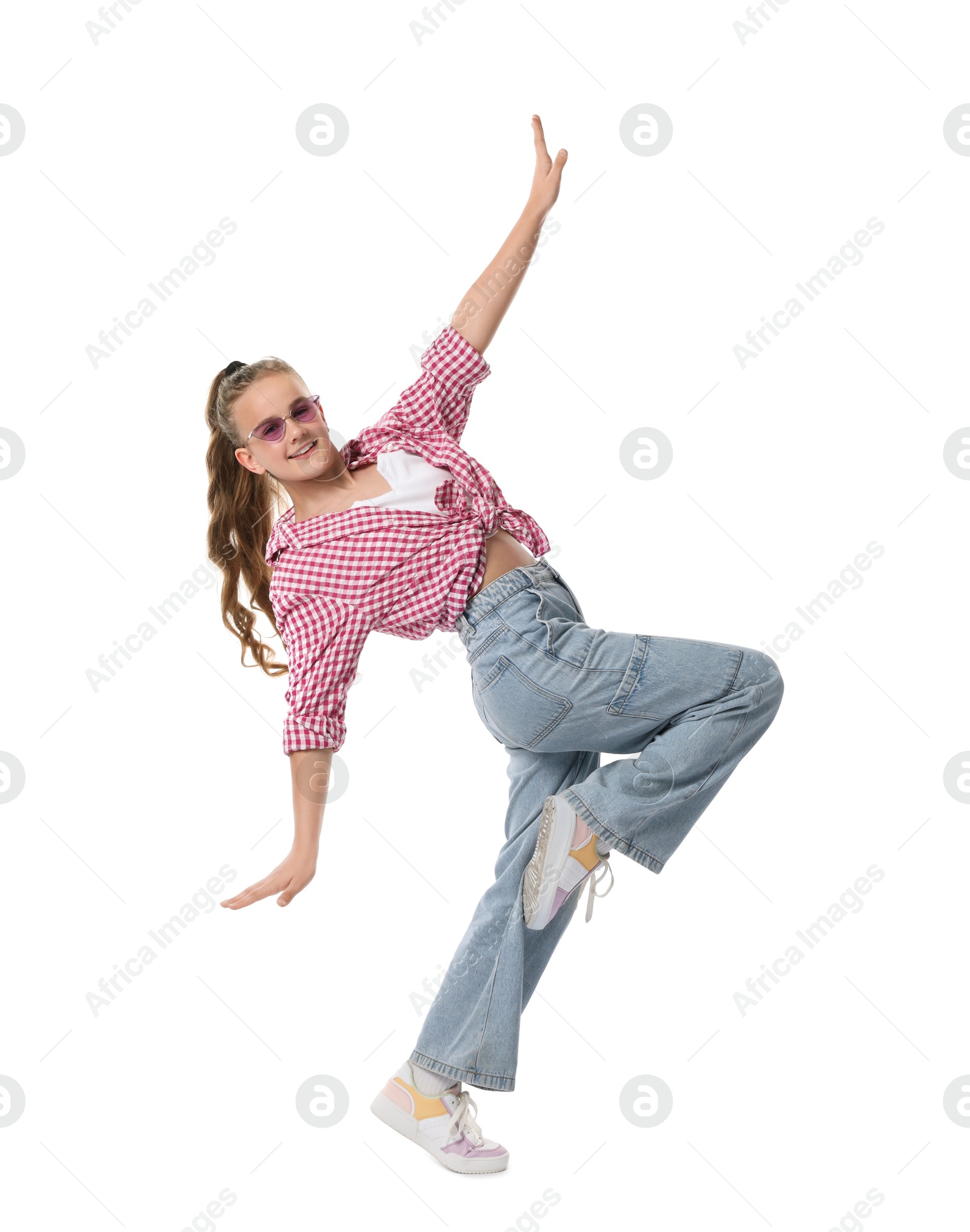 Girl in stylish clothes and sunglasses dancing on white background Photo of Girl in stylish clothes and sunglasses dancing on white background