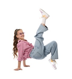 Photo of Girl in stylish clothes and sunglasses dancing on white background