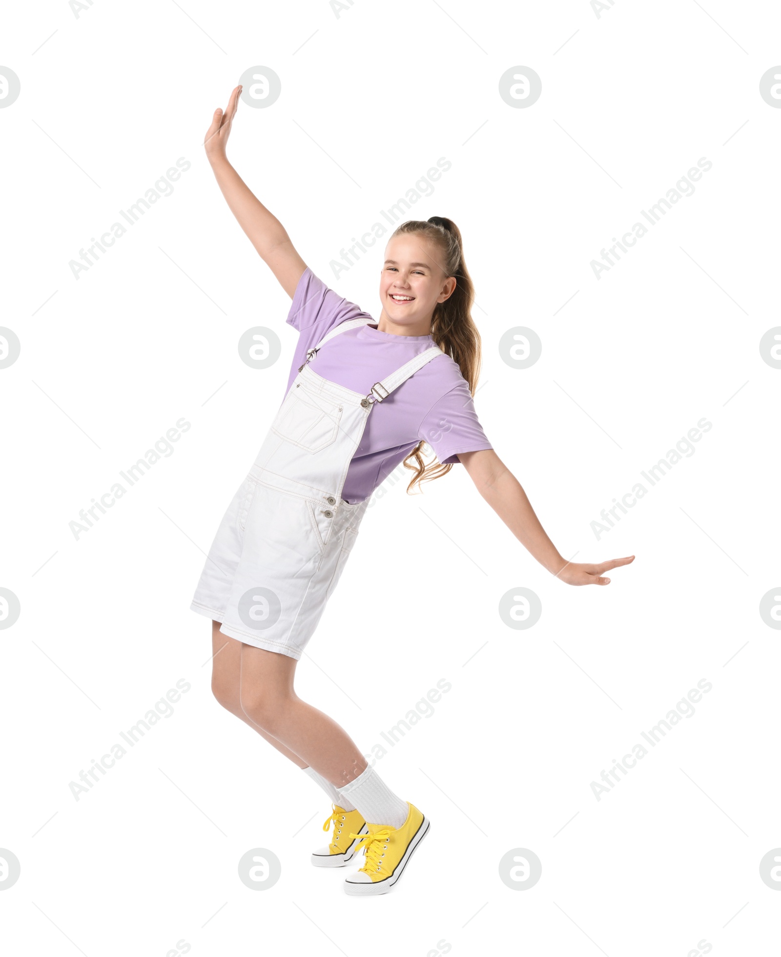 Photo of Girl in stylish clothes dancing on white background