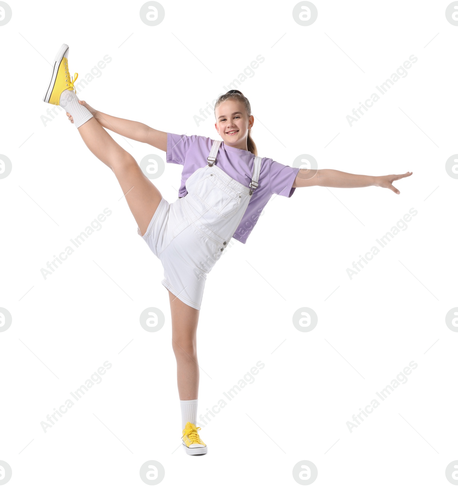 Girl in stylish clothes dancing on white background Photo of Girl in stylish clothes dancing on white background