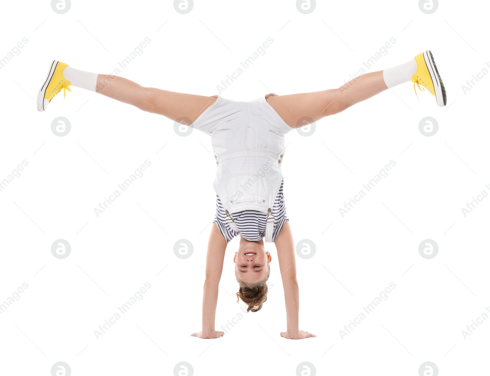 Girl in stylish clothes dancing on white background Photo of Girl in stylish clothes dancing on white background