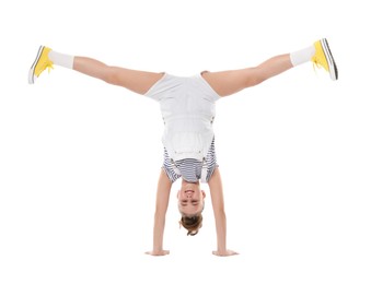 Photo of Girl in stylish clothes dancing on white background