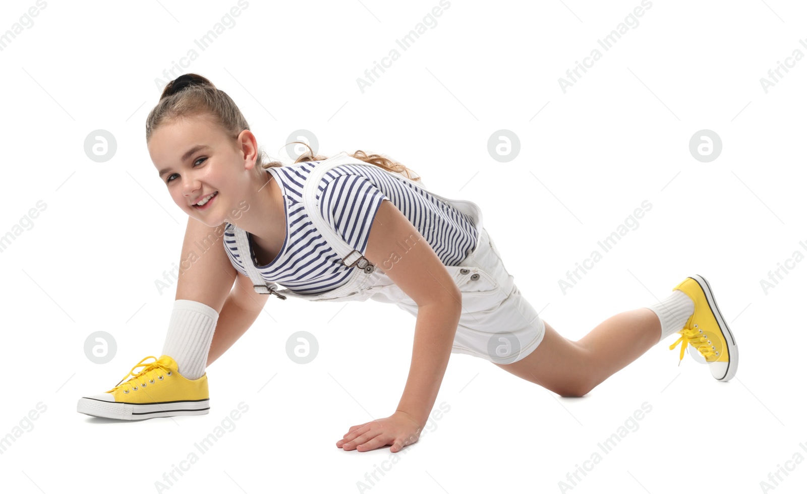 Photo of Girl in stylish clothes dancing on white background