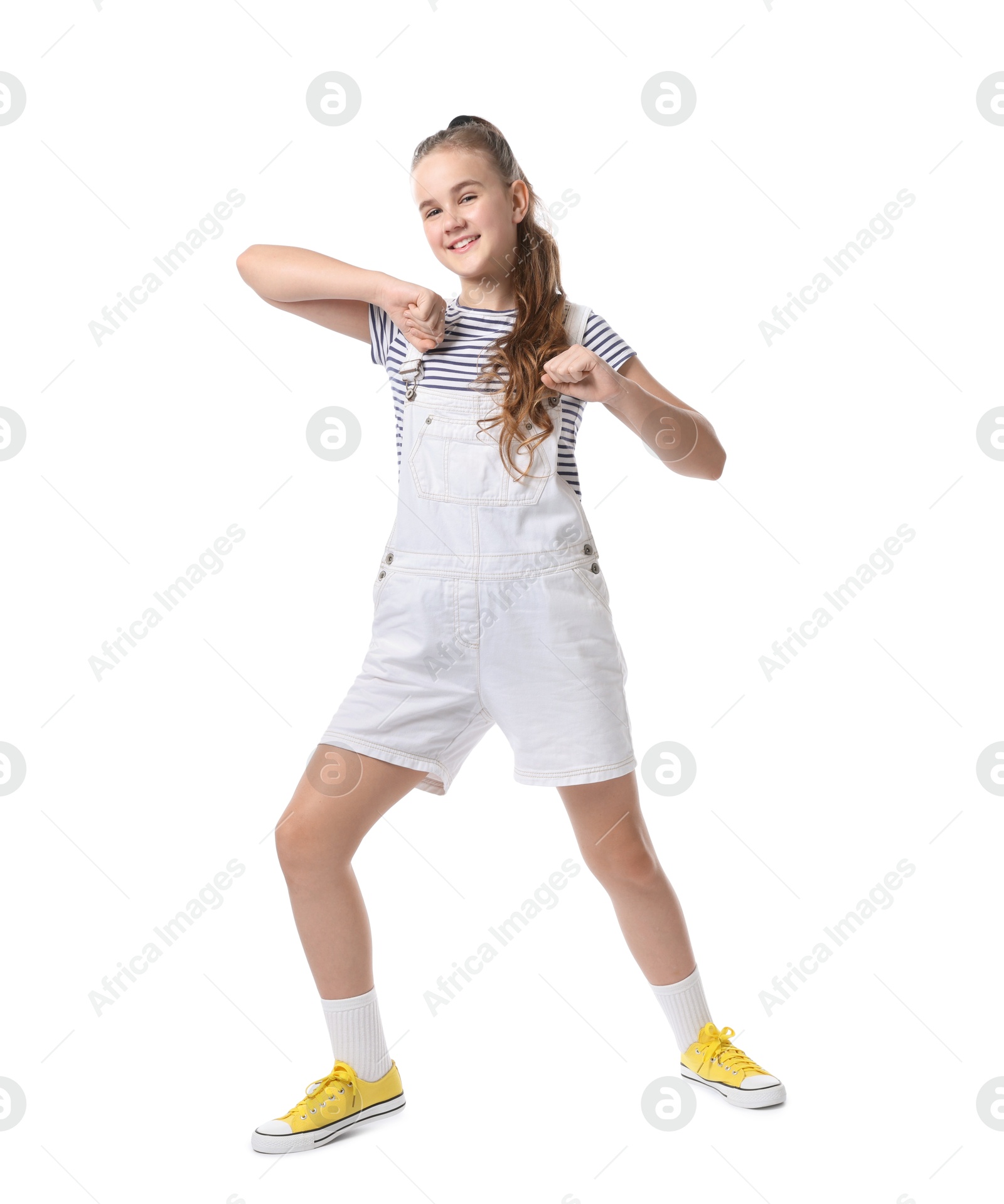 Photo of Girl in stylish clothes dancing on white background