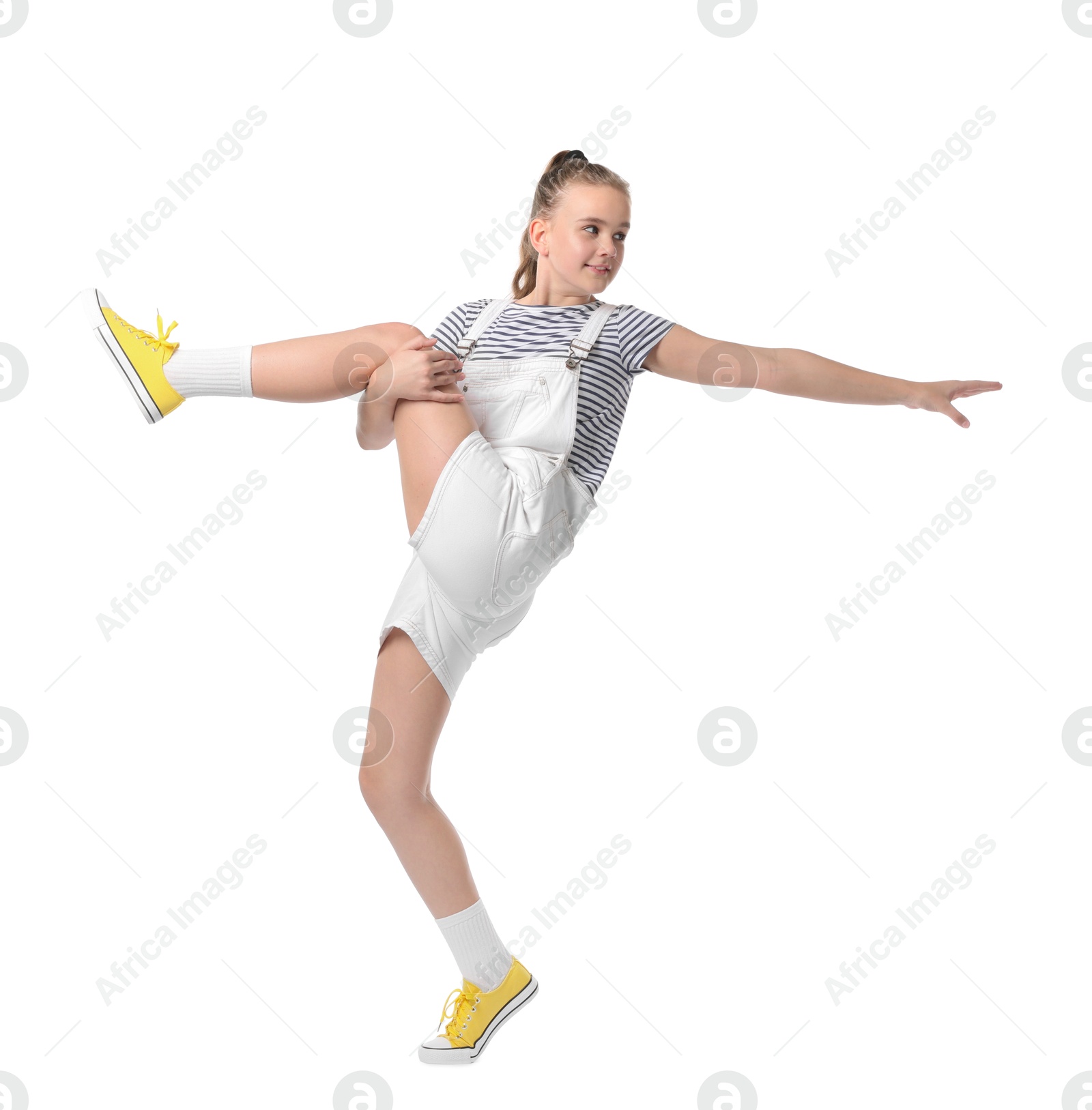 Girl in stylish clothes dancing on white background Photo of Girl in stylish clothes dancing on white background