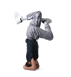 Photo of Boy in stylish clothes dancing on white background