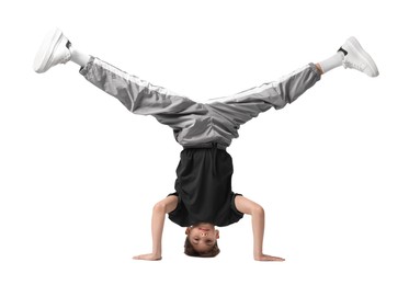 Photo of Boy in stylish clothes dancing on white background