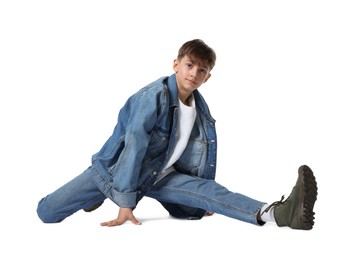Photo of Boy in stylish clothes dancing on white background