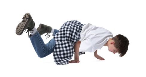 Photo of Boy in stylish clothes dancing on white background