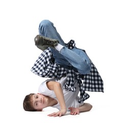Photo of Boy in stylish clothes dancing on white background