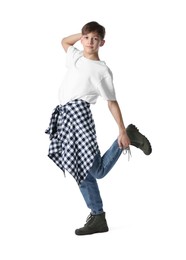 Photo of Boy in stylish clothes dancing on white background