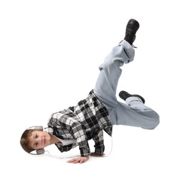Photo of Boy with headphones in stylish clothes dancing on white background