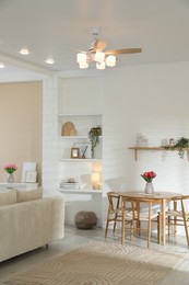 Photo of Stylish dining table with chairs in room. Interior design