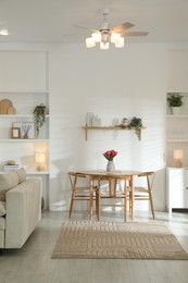 Photo of Stylish dining table with chairs in room. Interior design