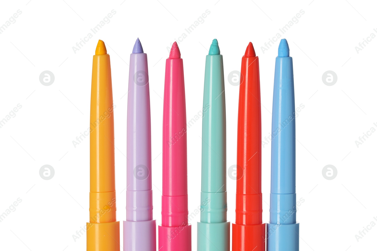 Bright twist up eye pencils isolated on white Photo of Bright twist up eye pencils isolated on white