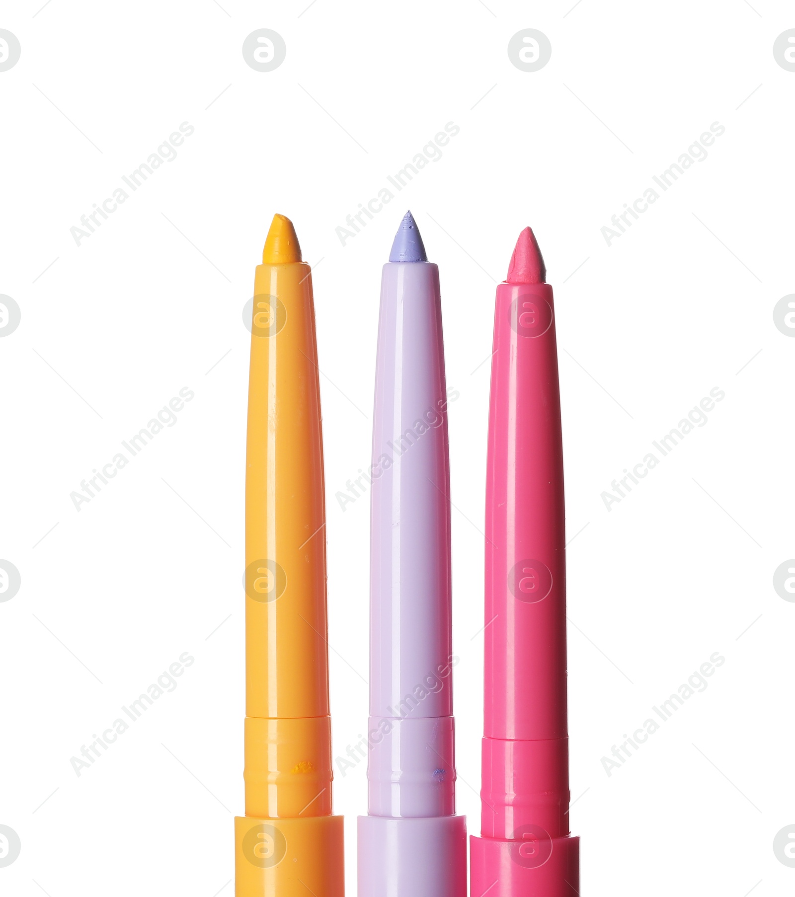 Bright twist up eye pencils isolated on white Photo of Bright twist up eye pencils isolated on white