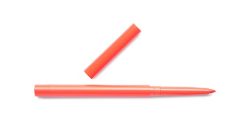 Photo of Orange twist up eye pencil isolated on white, top view