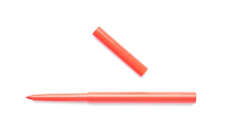Photo of Orange twist up eye pencil isolated on white, top view