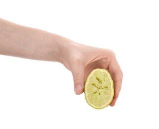 Photo of Woman squeezing lime on white background, closeup