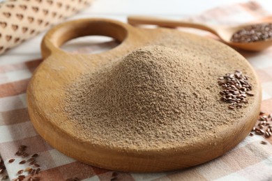 Photo of Pile of flaxseed flour on table, closeup