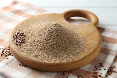 Photo of Pile of flaxseed flour on table, closeup