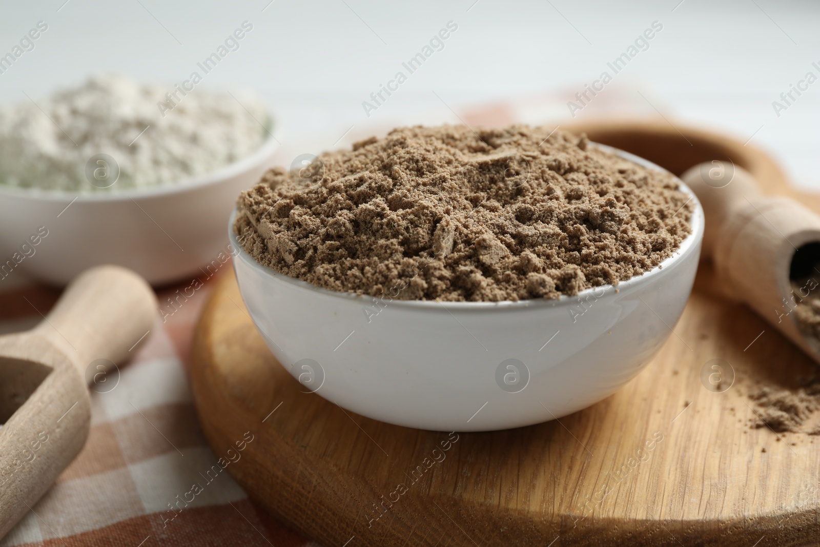 Different types of flour in bowls on table, closeup Photo of Different types of flour in bowls on table, closeup