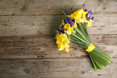 Photo of Bunch of beautiful flowers on wooden table, top view. Space for text