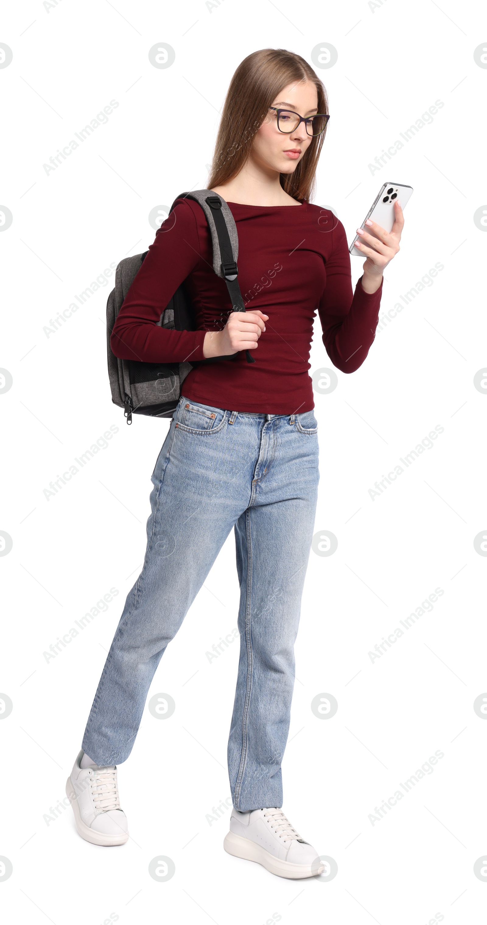 Photo of Teenage girl with backpack and smartphone on white background